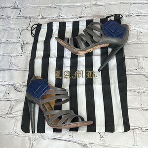 L.A.M.B. Rae strappy stiletto sandals in gray leather blue leather rose detail